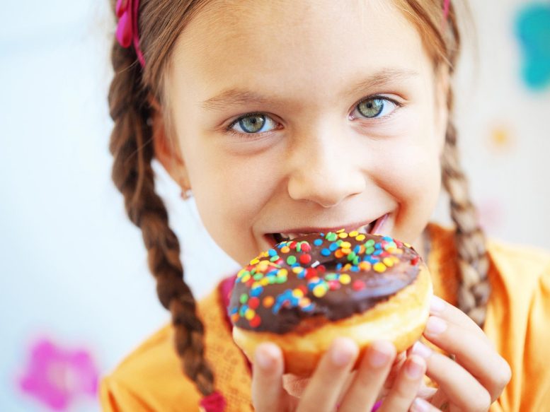 Child Eating Donut