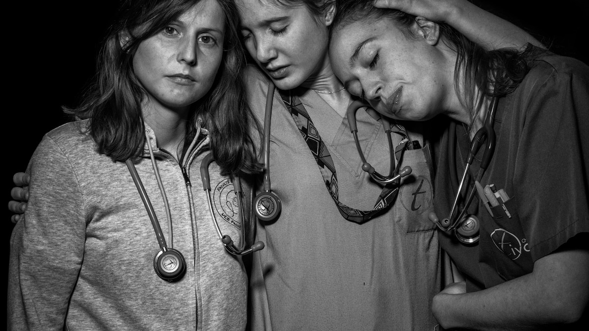 Health workers are exhausted. A photo studio let them express it.