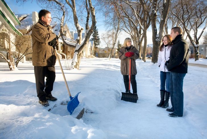 Couples visiting outside in the snow, Edmonton, Alberta, Canada