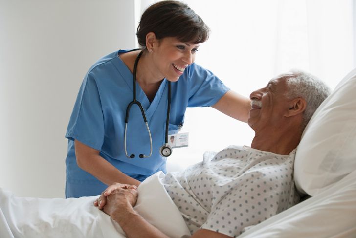 Nurse with elderly male patient