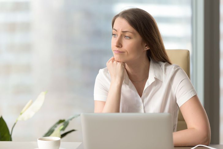 distracting unmotivated woman at work looking out the window