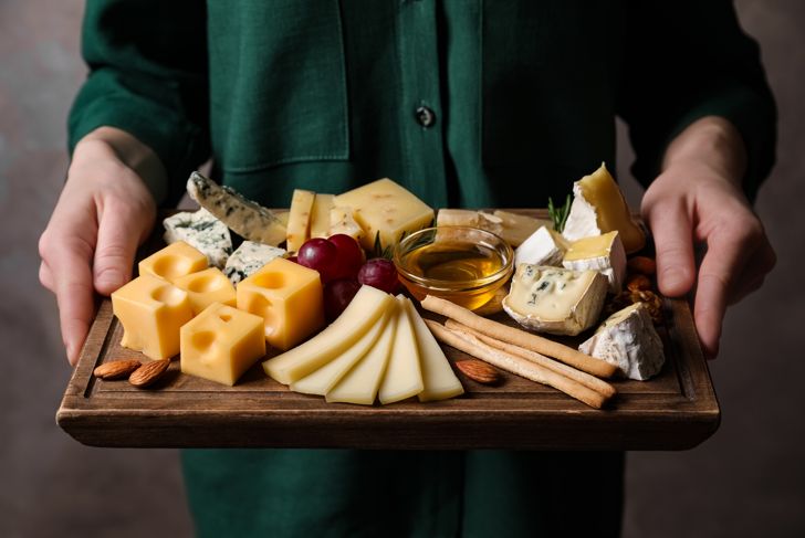 Woman with cheese board