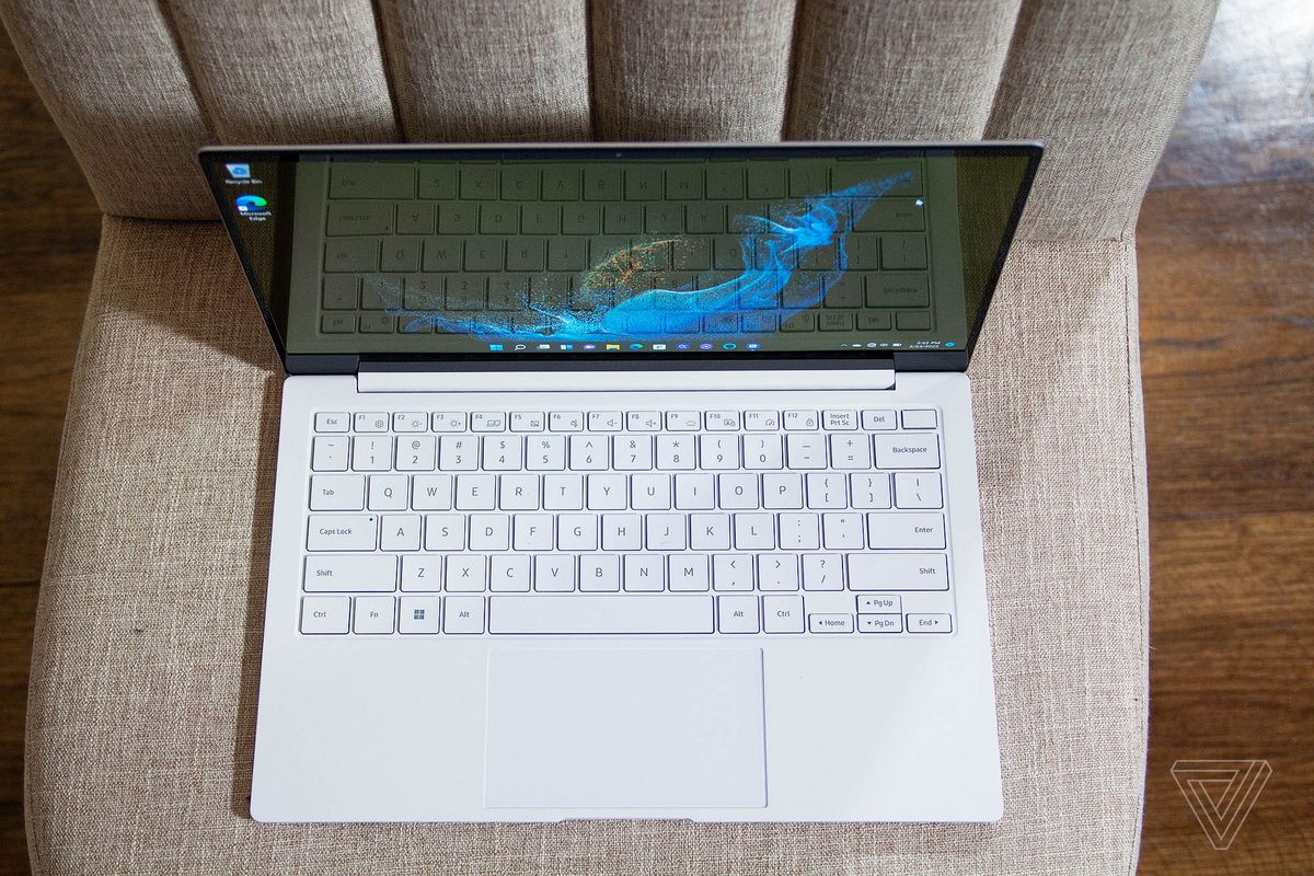 The galaxy book 2 pro's keyboard seen from above on a white plush chair.