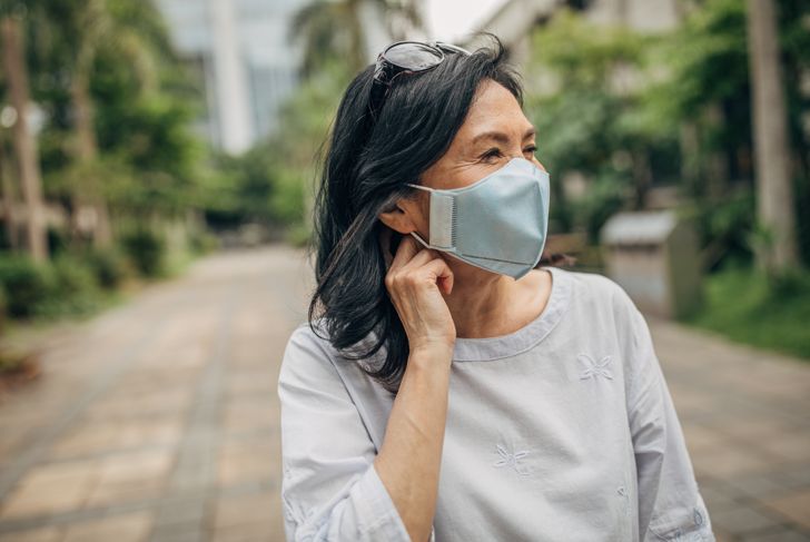 woman wearing face mask outdoors