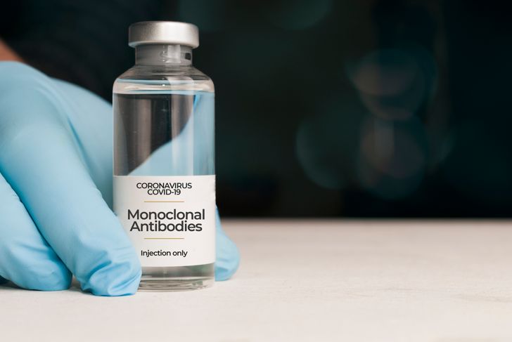 Doctor holding a vial of monoclonal antibodies