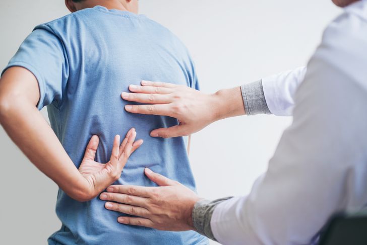 Doctor consultation with patient Back problems
