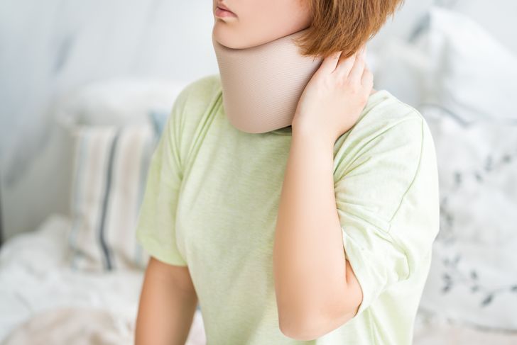 Woman wearing a neck brace