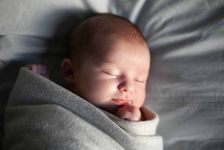 A newborn baby girl is sleeping