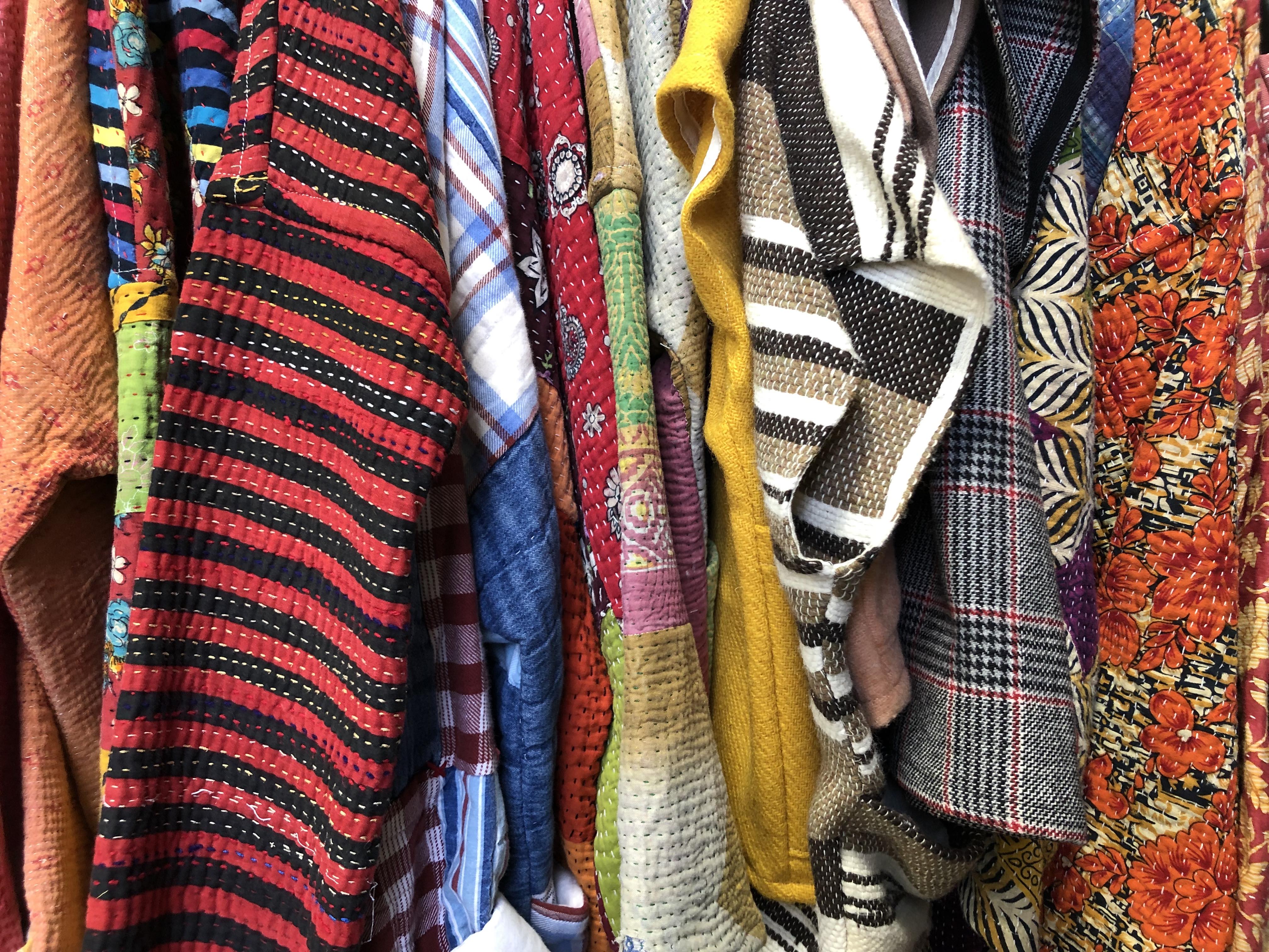 Portions of many colorful and multi-patterned jackets