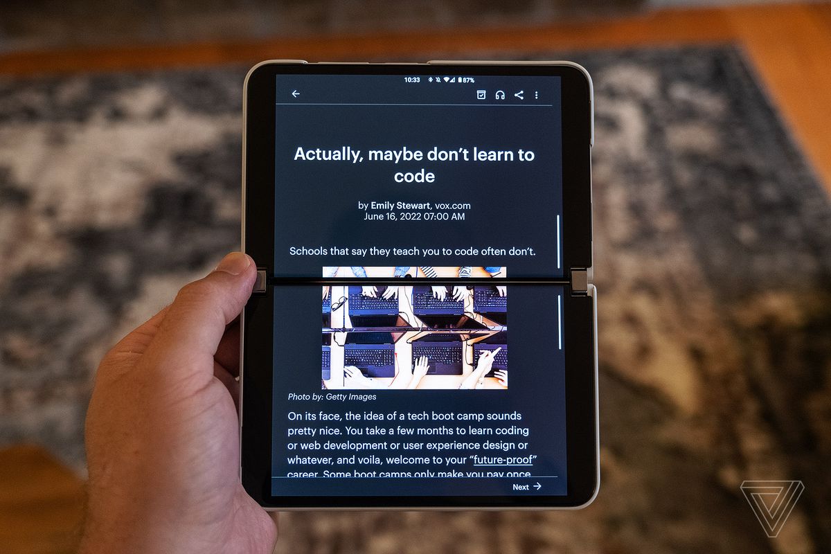The Pocket Android app displays an article on both screens of the Surface Duo 2 while in portrait orientation.