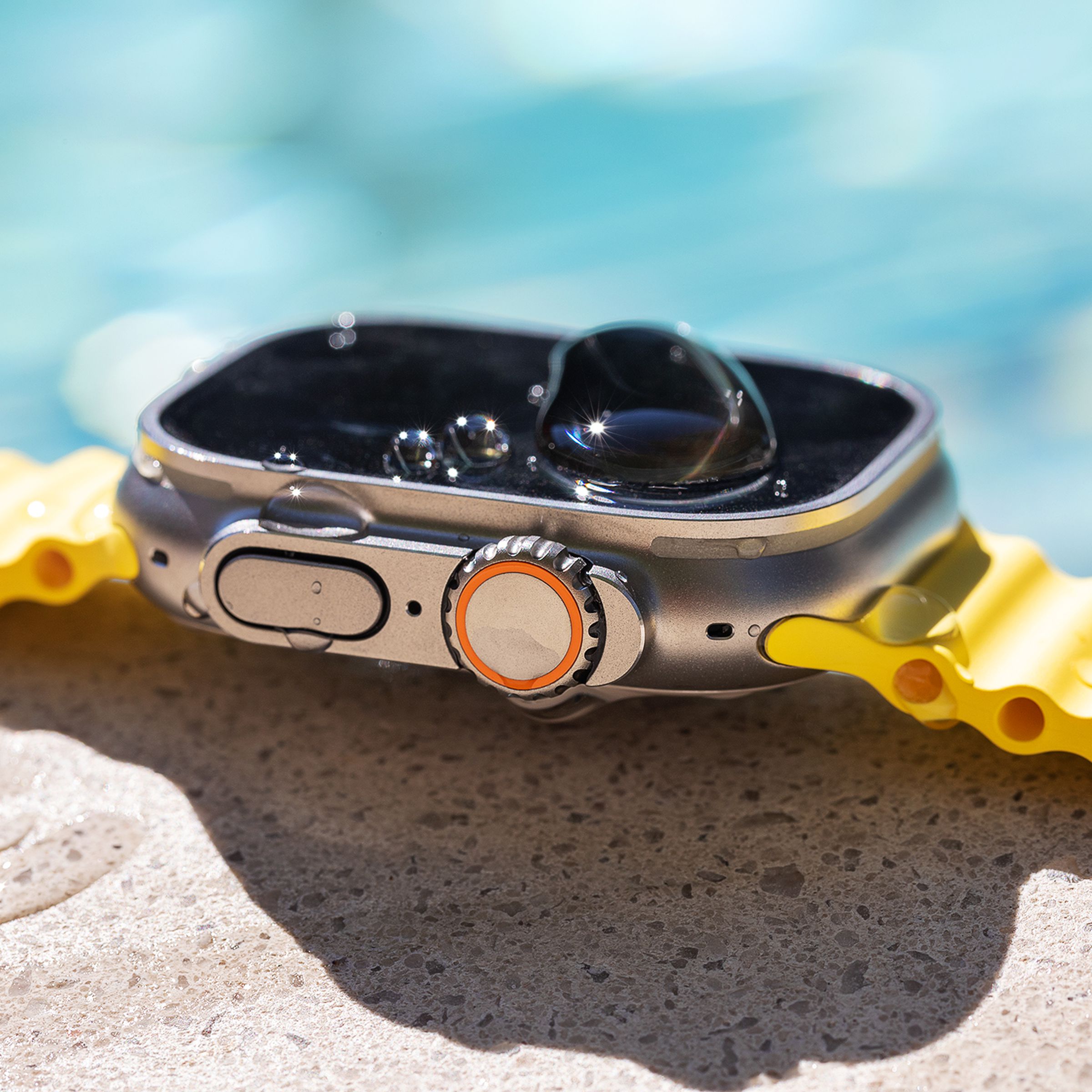 Side view of apple watch with ocean band by the pool